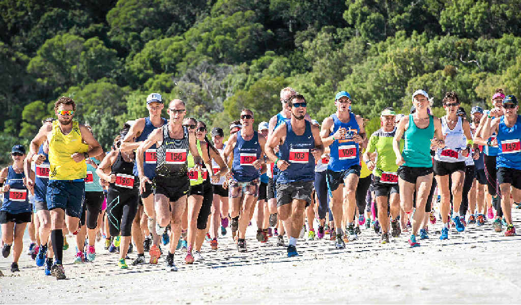 CHAMPION: Steve Moneghetti (centre left) leading the pack on his way to another win.